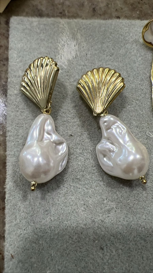 Aretes Noma